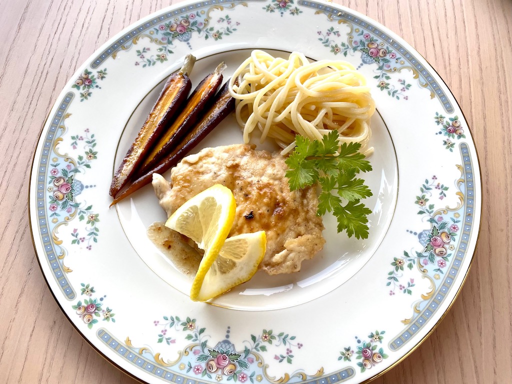 The children's dinner: chicken scallopini, spaghetti with oil and garlic, and buttered baby carrots.