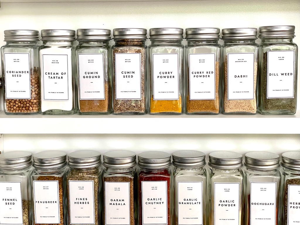 Putting herbs and spices into matching jars is a time-consuming project, but a satisfying staycation activity.