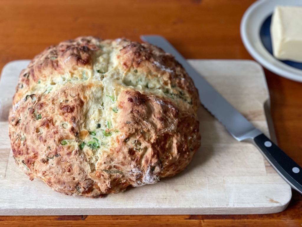 Easy Irish soda bread, still warm from the oven, is ready to slice.