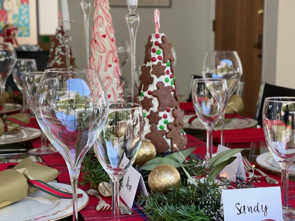 Cookies are "glued" to styrofoam cones covered first in plastic wrap using thick icing. The cookies can be eaten off the cone as part of the evening's dessert..