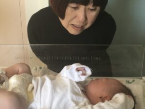 Grandma meeting grandchild for the first time.