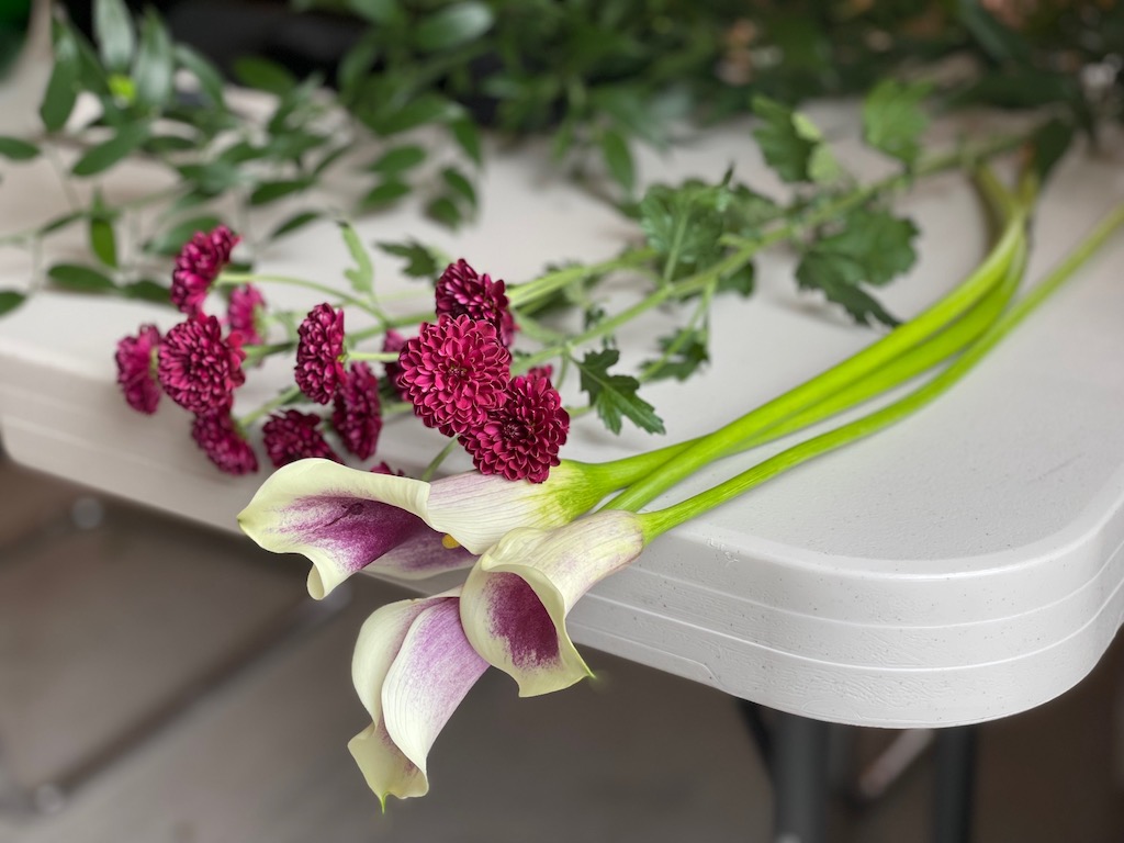 Flowers at an ikebana class, ready to be arranged.