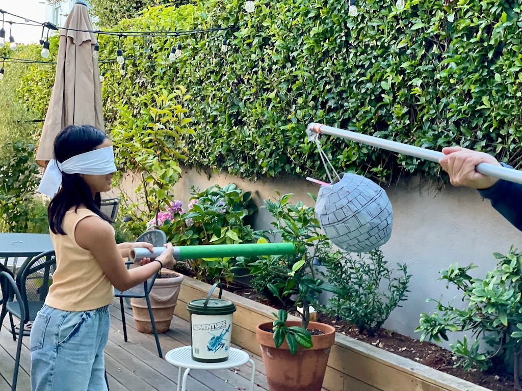 Another blindfolded child whacking away at the Death Star piñata.