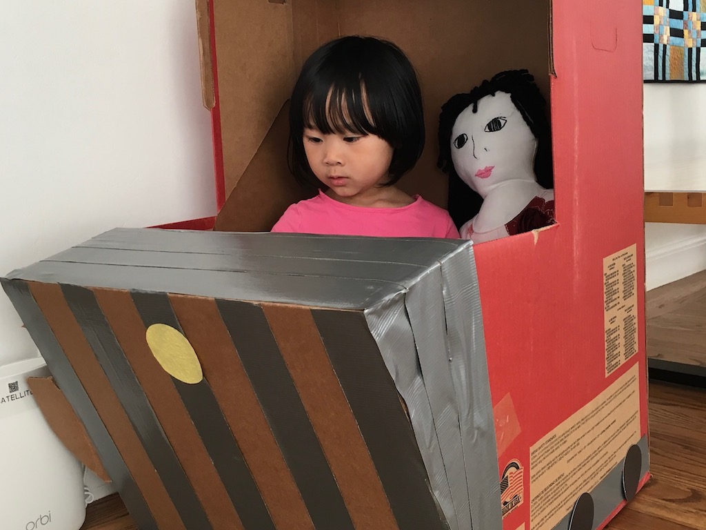 Turn a car seat box into a train engine with duct tape and construction paper controls and wheels.