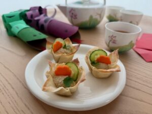 Wonton cups are filled with hummus for a tea party for grandkids.