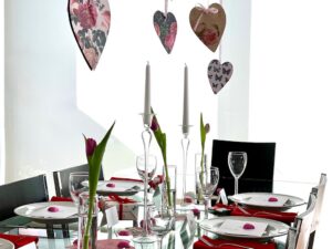 Suspend cardstock hearts over light fixtures for your valentine's party table.