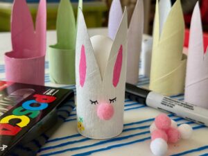 Toilet paper roll crafts: make an Easter bunny with paint, markers, and pompoms.