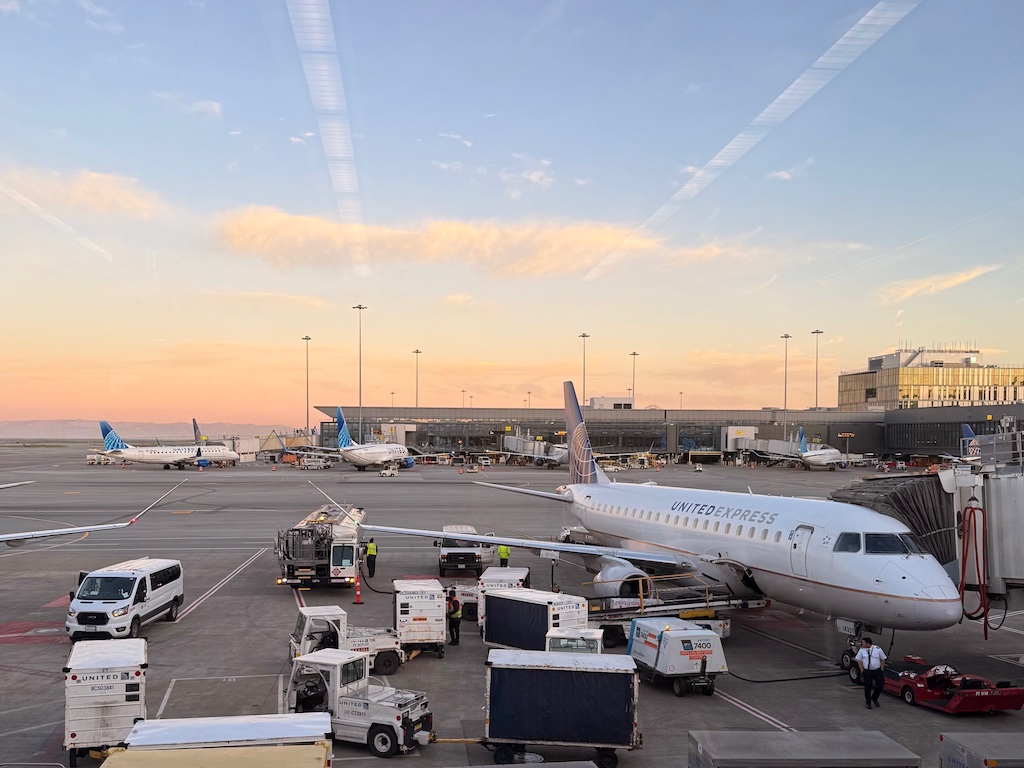 Airplane parked at an airport, ready to board passengers. Explore tips on traveling for older adults: it's news you can use.