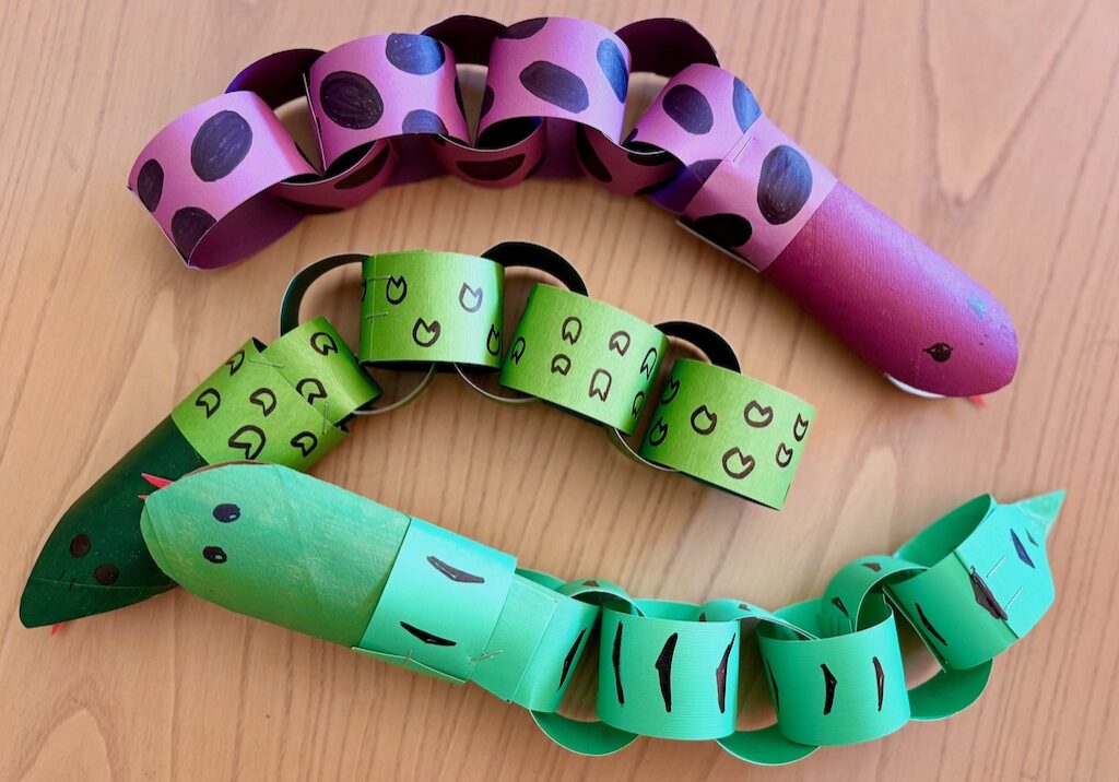 These DIY Chinese New Year snakes are easy to make with a toilet roll and cardstock.