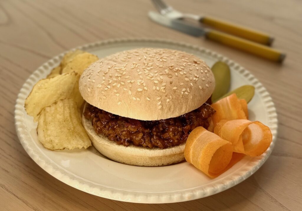 Sloppy Joes features ground beef in a sweet and tangy sauce, served on toasted buns.