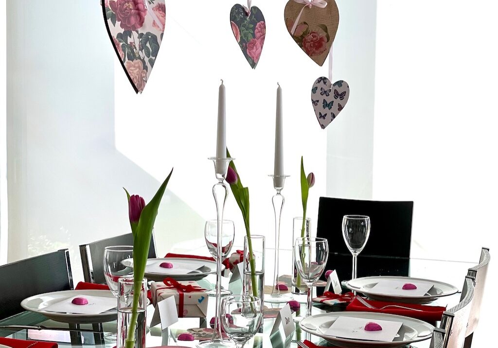 Suspend cardstock hearts over light fixtures for your valentine's party table.