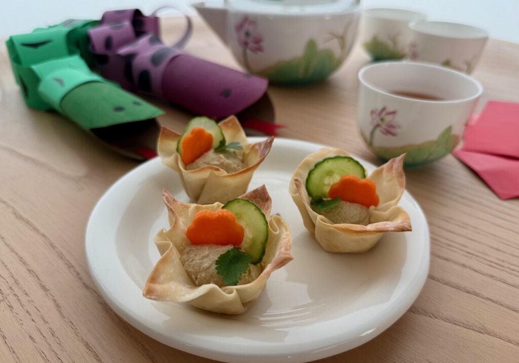 Wonton cups are filled with hummus for a tea party for grandkids.